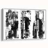 Framed black and white abstract wall art showcasing geometric shapes and lines, set against a white background, viewed from the side.