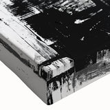 Abstract black and white stretched canvas wall art showcasing intricate geometric patterns and textures, perfect for modern home decor.
