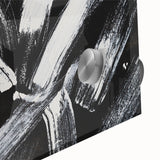 Close-up of a striking black and white abstract wall art design, showcasing fluid shapes and textures, ideal for modern decor accents.
