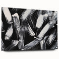 Abstract black-and-white acrylic glass wall art collection displayed from a side view, featuring sharp geometric shapes and modern design elements.