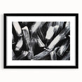 Framed black and white abstract wall art design showcasing geometric shapes and lines, perfect for modern home decor. The artwork is presented in a sleek black frame with a white mat, creating a stylish contrast suitable for any contemporary setting.