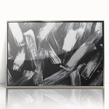 Framed black and white abstract wall art design with sleek silver accents, showcasing modern geometric patterns for contemporary decor.