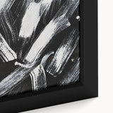 Close-up of a framed black and white abstract design canvas art piece, showcasing intricate patterns and textures, ideal for modern decor.