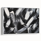 Framed black and white abstract wall art showcasing a modern design with intricate patterns, positioned against a white wall for contrast.