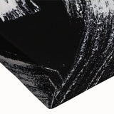 Close-up of a black and white abstract design wall art piece on stretched canvas, showcasing intricate patterns and textures ideal for modern decor.