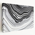 Abstract black and white wall art collection on stretched canvas, showcasing dynamic shapes and textures, ideal for modern home decor.