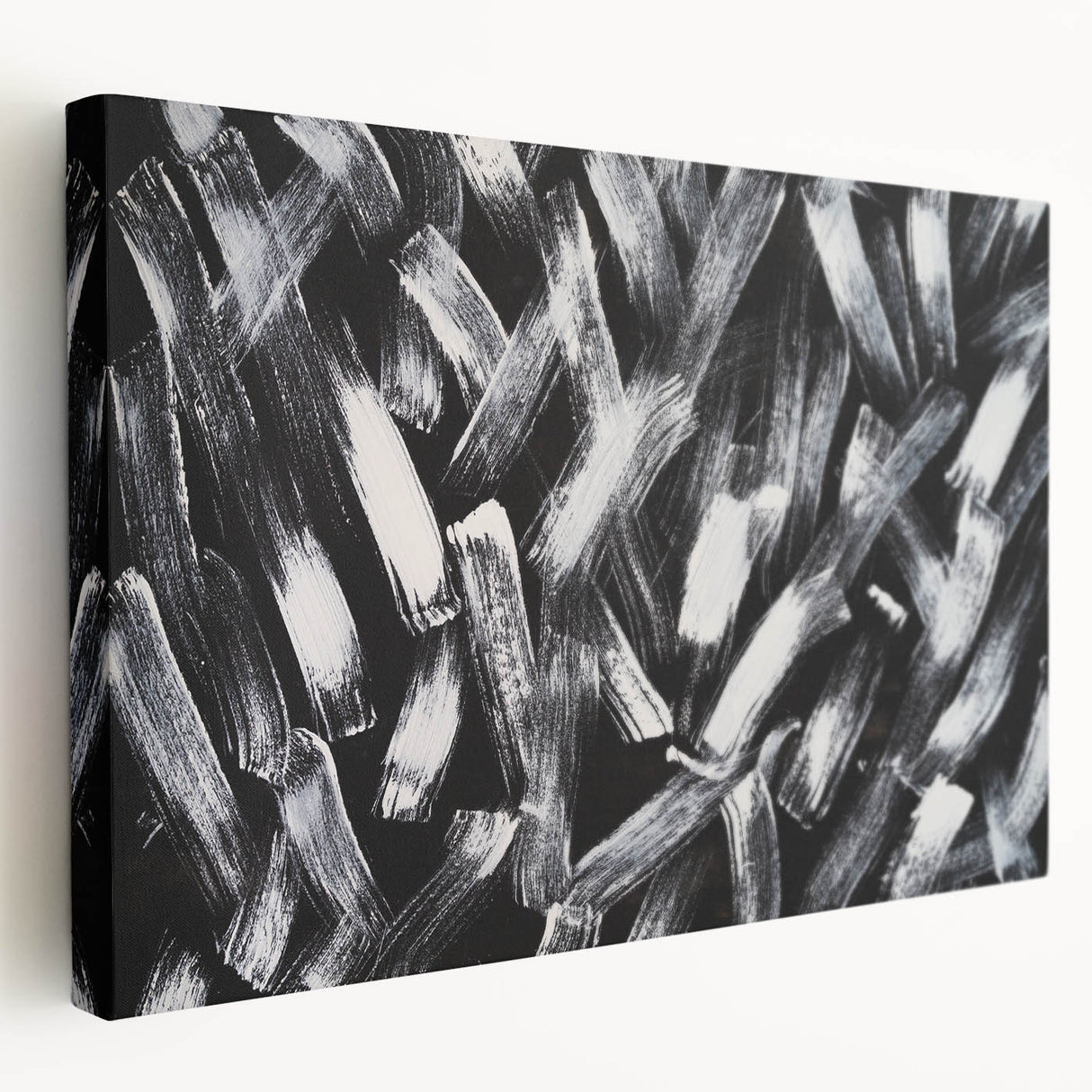 Stretched canvas displaying a black and white abstract wall art design, showcasing fluid shapes and textures, ideal for modern home decor.