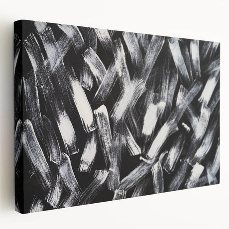 Stretched canvas displaying a black and white abstract wall art design, showcasing fluid shapes and textures, ideal for modern home decor.