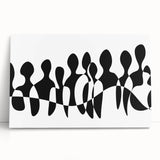 Abstract black and white wall art collection displayed on a stretched canvas, featuring dynamic geometric shapes that enhance modern decor.