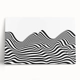 Abstract black and white stretched canvas wall art leaning against a wall, showcasing dynamic shapes and textures for modern decor.