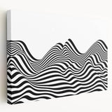Abstract black and white stretched canvas wall art showcasing fluid shapes and contrasting designs, perfect for modern home decor aesthetics.