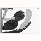 Abstract black and white wall art collection on stretched canvas, showcasing dynamic geometric shapes and patterns, perfect for modern decor.