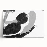 Abstract black and white wall art collection on stretched canvas, showcasing geometric shapes and fluid patterns, perfect for modern decor.