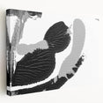 Abstract black and white wall art canvas with a stretched design, showcasing fluid shapes and patterns, ideal for modern home decor.