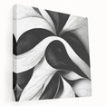 Abstract black and white wall art collection displayed on stretched canvas, showcasing modern geometric shapes and textures in a side view.
