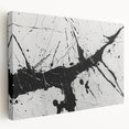 Abstract black and white wall art canvas showcasing a modern design with geometric shapes, viewed from the side, emphasizing its textured surface and sleek profile.