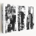 Stretched canvas showcasing a modern black and white abstract wall art design, emphasizing bold geometric shapes and textures, ideal for contemporary decor.