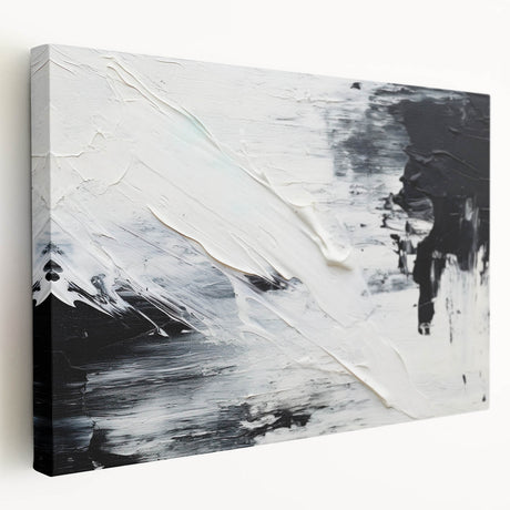 Abstract black and white stretched canvas wall art showcasing a modern design, displayed from the side to highlight its depth and texture.