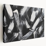 Abstract black and white wall art collection on stretched canvas, showcasing geometric shapes and textures, perfect for modern home decor.