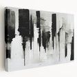 Stretched canvas artwork showcasing an abstract black-and-white design, emphasizing bold lines and geometric shapes, ideal for modern decor.