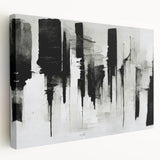 Stretched canvas artwork showcasing an abstract black-and-white design, emphasizing bold lines and geometric shapes, ideal for modern decor.