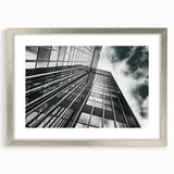 Black and white abstract art print in a silver frame, featuring swirling patterns, ideal for dining room or bedroom decor.