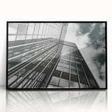 Large abstract wall art in black and white, framed in black acrylic, in a mid-century modernist style.