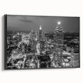 Black and white framed canvas of Atlanta skyline, featuring detailed vintage poster art, ideal for bedroom wall decor.