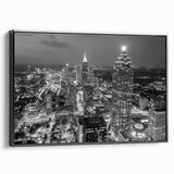 Black and white framed canvas of Atlanta skyline, featuring detailed vintage poster art, ideal for bedroom wall decor.