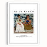 Abstract art print of Frida Kahlo in muted colors, framed in white, suitable for bedroom or dining room decor.