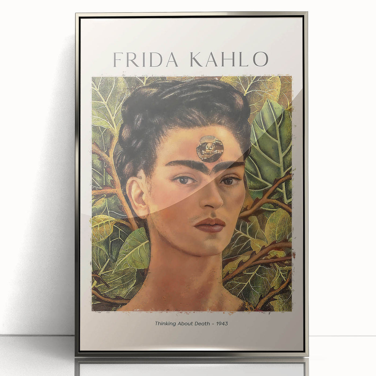 Mid-century modernist art featuring a stylized portrait of Frida Kahlo in muted tones on a silver-framed acrylic print.