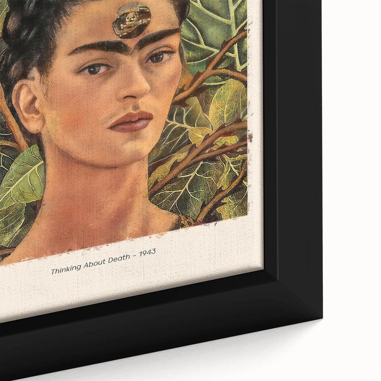 Close-up of a black framed canvas featuring a textured, colorful depiction of Frida Kahlo, ideal for living room decor.