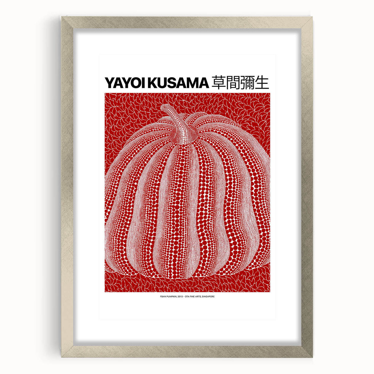 Textured abstract art print in vibrant red and white, framed in silver, ideal for modern bedroom ambiance.