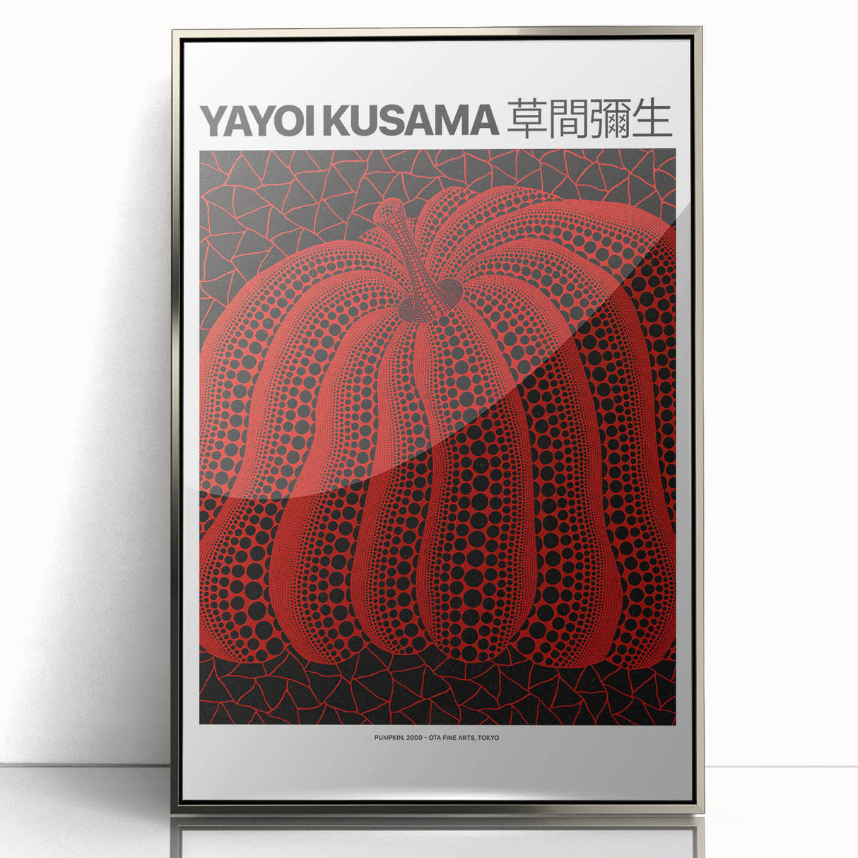 Mid-century modernist art featuring geometric patterns in silver and black on a framed acrylic.
