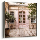 Framed canvas of vintage poster art featuring a French door in muted black and colorful tones, ideal for living room decor.