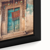 Close-up of a black framed canvas depicting a textured, colorful Indian door, ideal for extra large living room wall art.