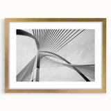 Extra large abstract art print depicting textured swirls in gold and beige, framed, ideal for living room decor.