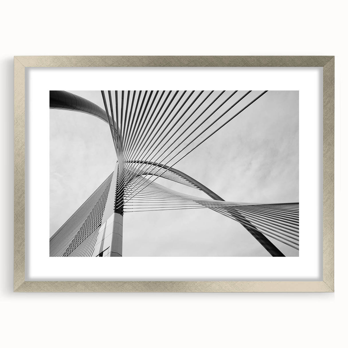 Textured abstract art print in muted gray, framed in silver, ideal for modern bedroom ambiance.