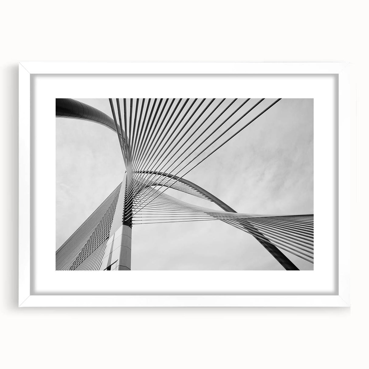 Abstract art print featuring geometric shapes in muted gray and blue tones on a framed white canvas.