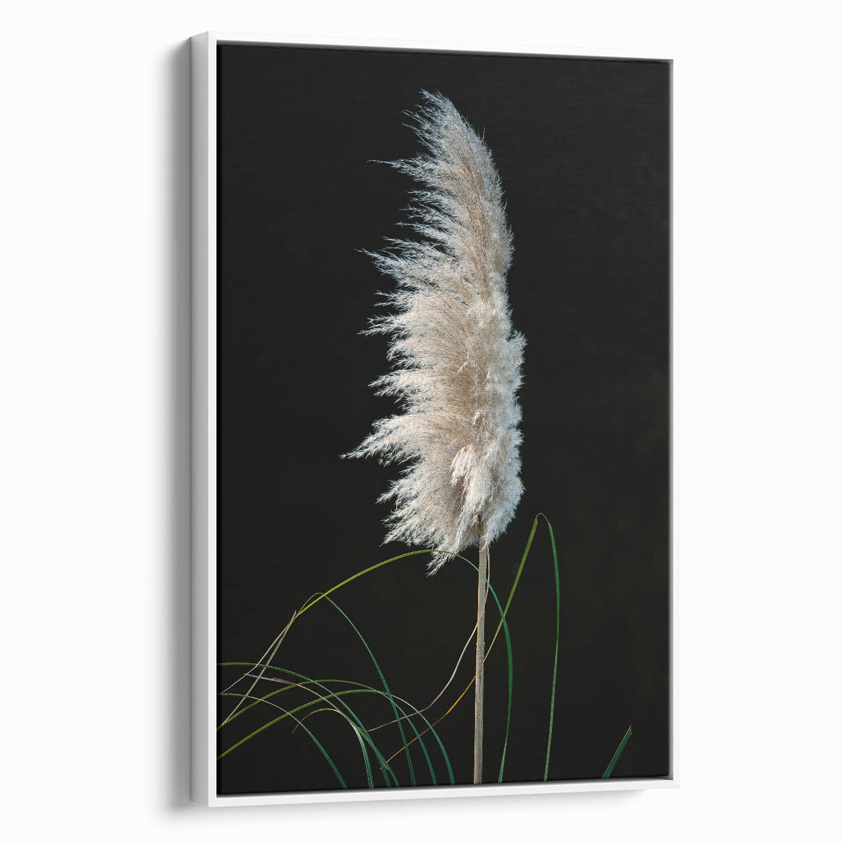 Framed canvas artwork showcasing a vibrant floral and botanical design, displayed in a sleek white frame, ideal for home decor and enhancing interior aesthetics.
