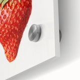 Large abstract wall art featuring assorted fruits in vibrant colors on acrylic glass, suitable for dining room decor.