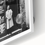 Large acrylic glass print of abstract human figures in muted earth tones.