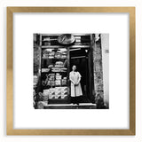 Extra large abstract art print featuring textured figures and food elements in muted earth tones, framed in gold.