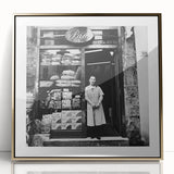 Large art print of people dining, in gold and white tones on acrylic, framed, mid-century modernist style.