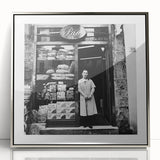 Mid-century modernist art featuring people dining, in muted earth tones, acrylic print in a silver frame.