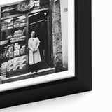Extra large black wall art on framed canvas featuring a close-up view of colorful, textured depictions of people and food.