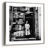 Framed canvas featuring a vintage poster-style landscape art painting with colorful figures and food.