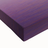 Close-up view of a stretched canvas artwork showcasing vibrant African tribal patterns in earthy tones, ideal for home decor or cultural inspiration.