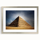 Abstract art print of an African desert scene in muted earth tones on a framed canvas, suitable for dining room decor.