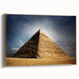 Framed canvas of an Egyptian landscape painting, featuring pyramids under a golden sky, ideal for living room decor.